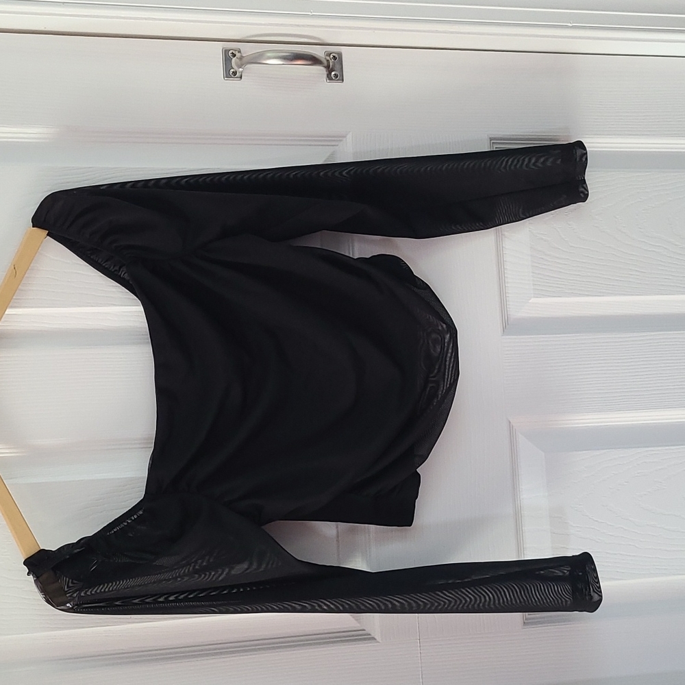 Long Sleeve top, sleeves are see through.  Top to bottom 12in.